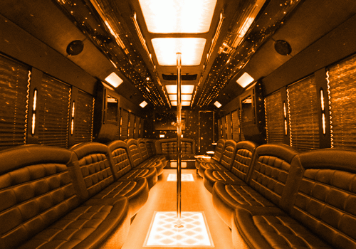 Luxury party bus rental interior with LED lights and leather seating in Houston